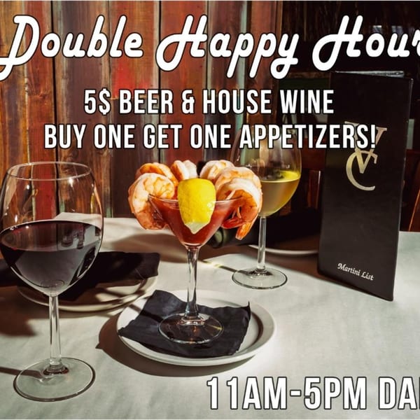 Shrimp cocktail, red wine, and white wine on a table with a "Double Happy Hour" promotion.