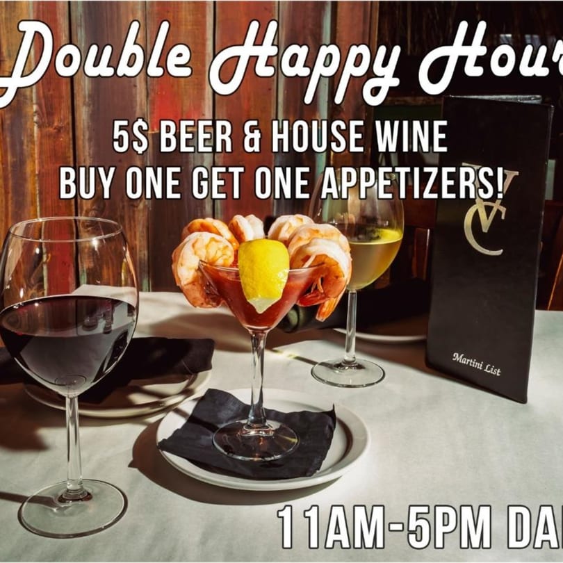 Shrimp cocktail, red wine, and white wine on a table with a "Double Happy Hour" promotion.